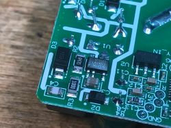 Interior of Sonoff Mini R2 Circuit Board Close-up of a circuit board section with electronic components of a Sonoff Mini R2.