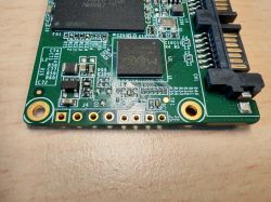 SSD Goodram CX400 PCB with visible diagnostic pins and IC components