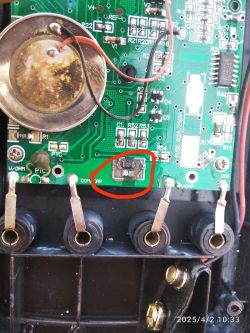 Printed Circuit Board with Damaged Component Printed circuit board with a marked electronic component.