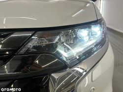 Close-up of a car headlight with LED light on.