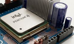 Close-up of Intel Pentium 4 CPU with a large 1.00µF 1500V capacitor on a motherboard