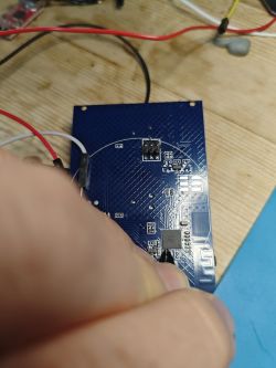 Electronic circuit board with wires and sewing needles attached to points P11/P10.