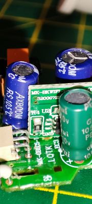 Close-Up of Circuit Board with Electronic Components Close-up of a circuit board with capacitors and a label MK-BK-WIFI-T2-DLV02(B).