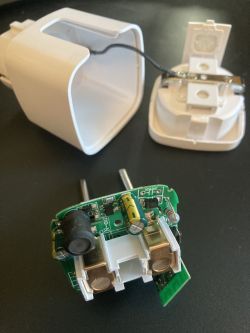 Dismantled Smart Plug from Aliexpress Dismantled Smart Plug with visible circuit board.