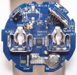 Close-up of the internal PCB of a smart plug.