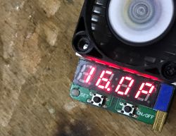 Electronic meter display showing a value of 16.0 and a cooling fan above it.