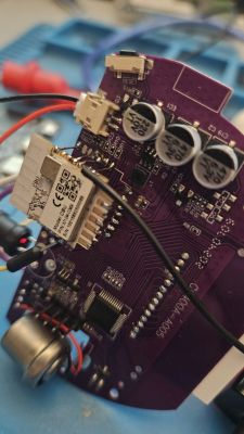 Close-up of a PCB with electronic components and a CBU connector.