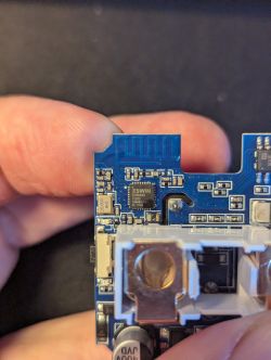Blue Circuit Board with Components Close-up photo of a blue circuit board with electronic components and the inscription ESWIN.