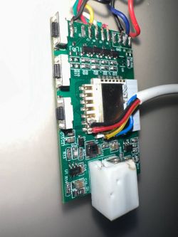 Tuya WX400P LED strip controller PCB with RGBW wiring and communication module visible.
