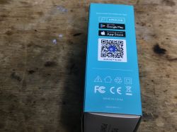 Side of Sonoff box with QR code and eWeLink app information.