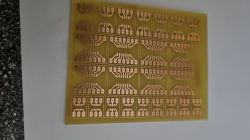 Etched PCB with SMD to THT adapter designs PCB board with etched SMD to THT adapter patterns on yellow laminate