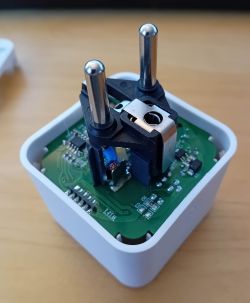 Interior of a Smart Plug with PCB Opened smart plug showing electronic components on the PCB.