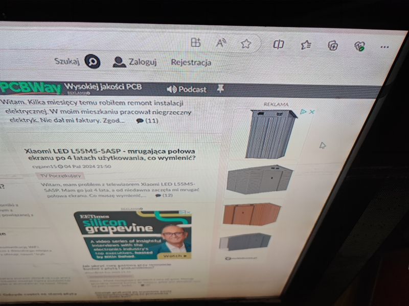 TV Screen Showing Online Forum About Televisions Close-up of a TV screen displaying a website with a discussion forum about televisions.