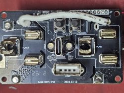 Circuit board with USB ports, push buttons, and a cable connected to header J7