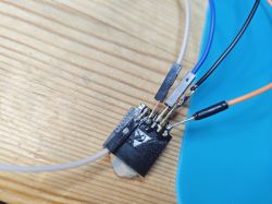 WiFi Module with Soldered Wires WiFi module with soldered wires on a wooden background