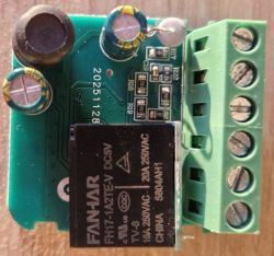 Relay module with capacitors and terminal block on green PCB