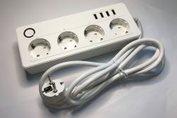 White power strip with four sockets and four USB-A ports on white background