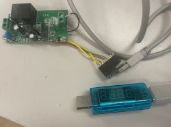 PCB with relay and wires connected to a USB meter with LED display