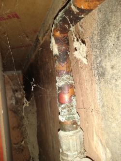 What Causes Sediment Deposits on Copper Pipes in a Central Heating System?