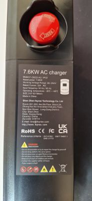 7.6 kW EV Charger with Reset Button EV charger housing with exposed red reset button and specification plate.
