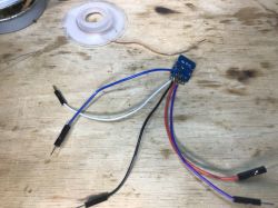 Connected PCB on a Wooden Surface PCB with connected wires on a wooden surface.
