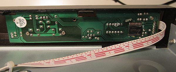 LED Controller Circuit Board with Ribbon Cable Close-up of a circuit board controller with a ribbon cable.
