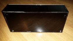 Black Plexiglass Enclosure Black plexiglass enclosure on a wooden floor