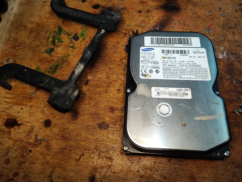 Flood-Damaged Samsung SV1021H Hard Drive Flood-damaged Samsung SV1021H hard drive on a wooden table