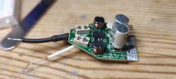 Interior of an Eveready LED driver with wires and capacitors.