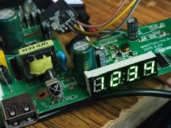 Close-up of a circuit board with an LED display showing numbers 1.8.9.4.
