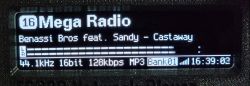 Audio device display showing radio station, song title, VU meter, and audio file parameters.