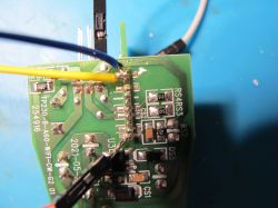 Close-up of a circuit board with soldered wires.
