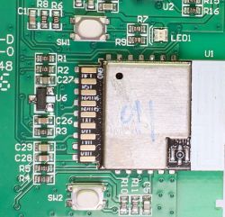 Electronic Module on PCB Close-up of a circuit board with an electronic module and micro switches.