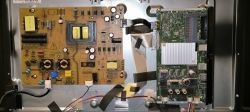 Inside of a Television with Electronic Boards Components inside a television, including a power board and main board.