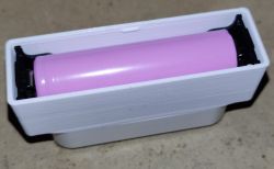 Pink 18650 battery housed in a white 3D-printed enclosure.