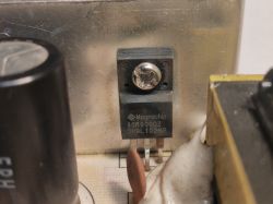 Magnachip 80R9000Z electronic component mounted on a metal surface.