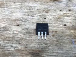MIC29150 3.3WU Voltage Regulator Voltage regulator MIC29150 3.3WU on a wooden table.