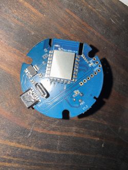 Round blue PCB with FLK-BX6-V1.4 module and USB-C connector
