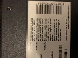 Label with barcode and warning text on the back casing of a television or similar device