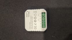 Small electrical device with six screw terminals labeled L, N, S1, S2