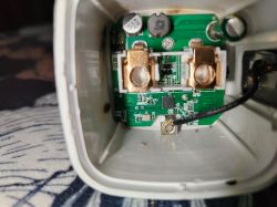 Interior of an electrical device with visible PCB and electronic components.