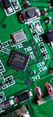Printed Circuit Board with BK7231N Chip Close-up of a green printed circuit board with various electronic components, including a BK7231N chip.