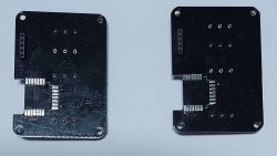 Two black PCB modules, each with mounting holes and pins at the top.