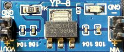 Voltage regulator module with AMS1117-3.3 chip on a blue PCB