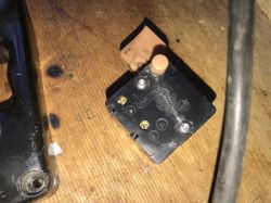 Electrical Switch on a Table Close-up of a plastic electrical switch on a wooden table.