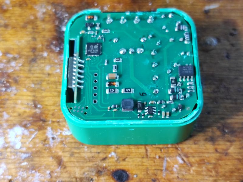 DIW-01 Dimmer Electronic Module Interior of a green electronic module with visible components and integrated circuits.