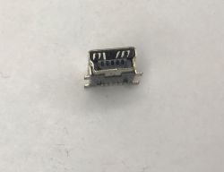Small metal mini or micro USB socket on a white surface