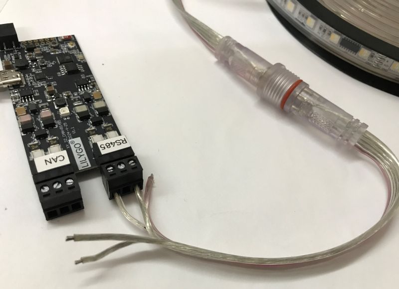 RGBW LED Strip Connected to ESP32 via RS485 RGBW LED strip with TM512C4 chip connected to ESP32 LilyGO T-CAN485 module on a white background.
