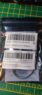 Close-up of two packaging bags with product labels for electronic items.