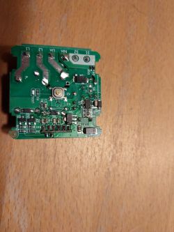 Circuit Board of a Roller Blind Controller Photo of an electronic controller circuit board on a wooden surface.